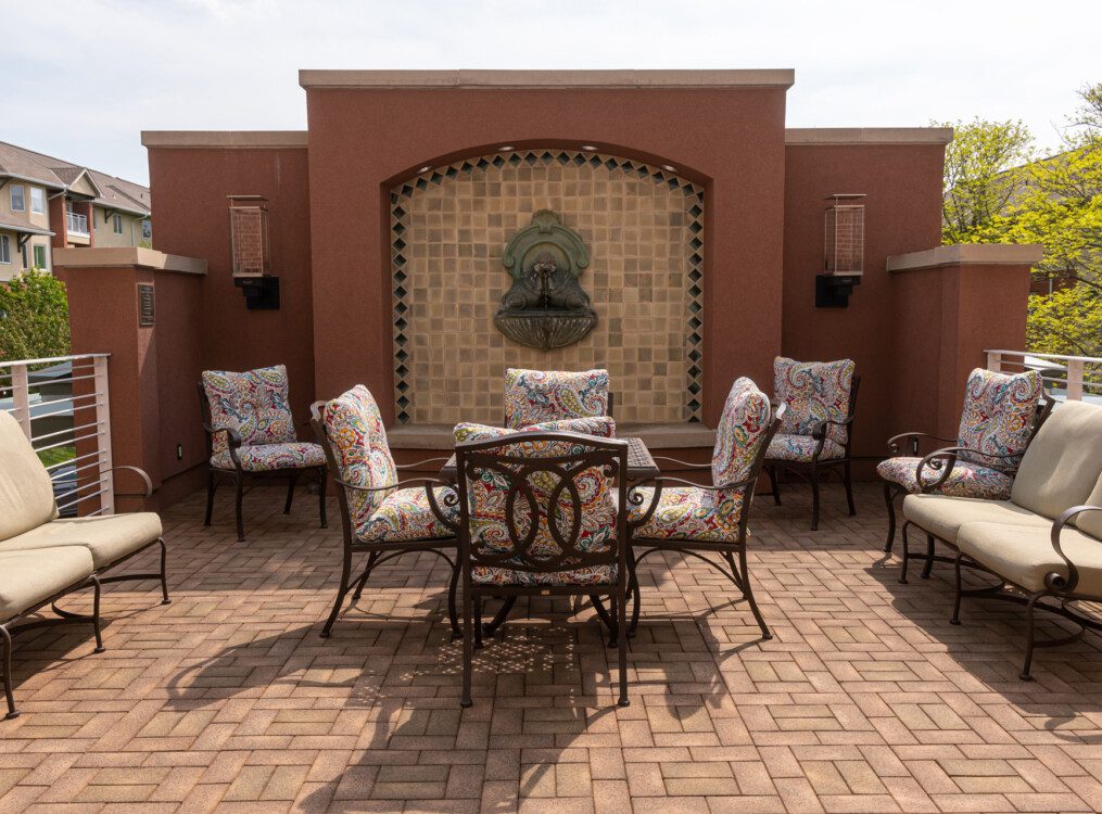 Beautiful terrace with seating at Claridge Court Senior Living Community