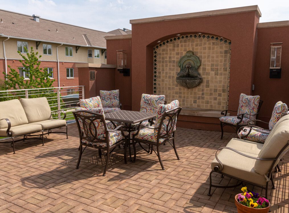 Beautiful terrace with seating at Claridge Court Senior Living Community