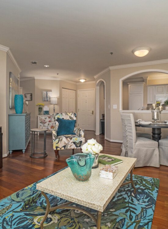 spacious living room and dining area of senior apartment at Claridge Court Senior Living Community